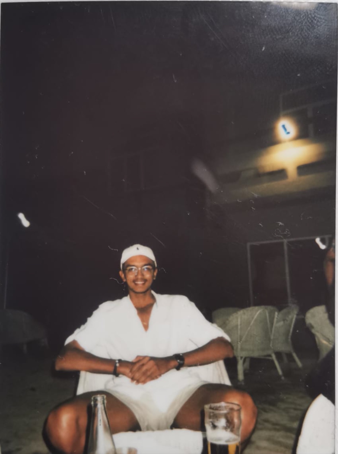 Old film photo of young Devam in white