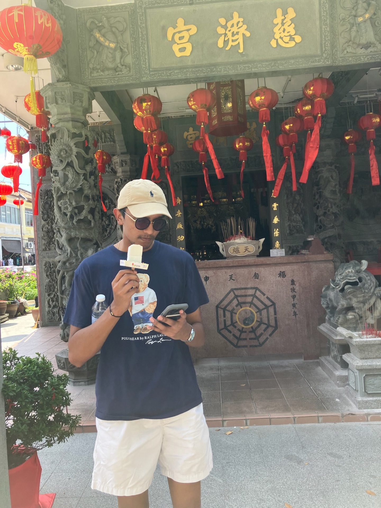 Devam eating ice cream in front of a temple