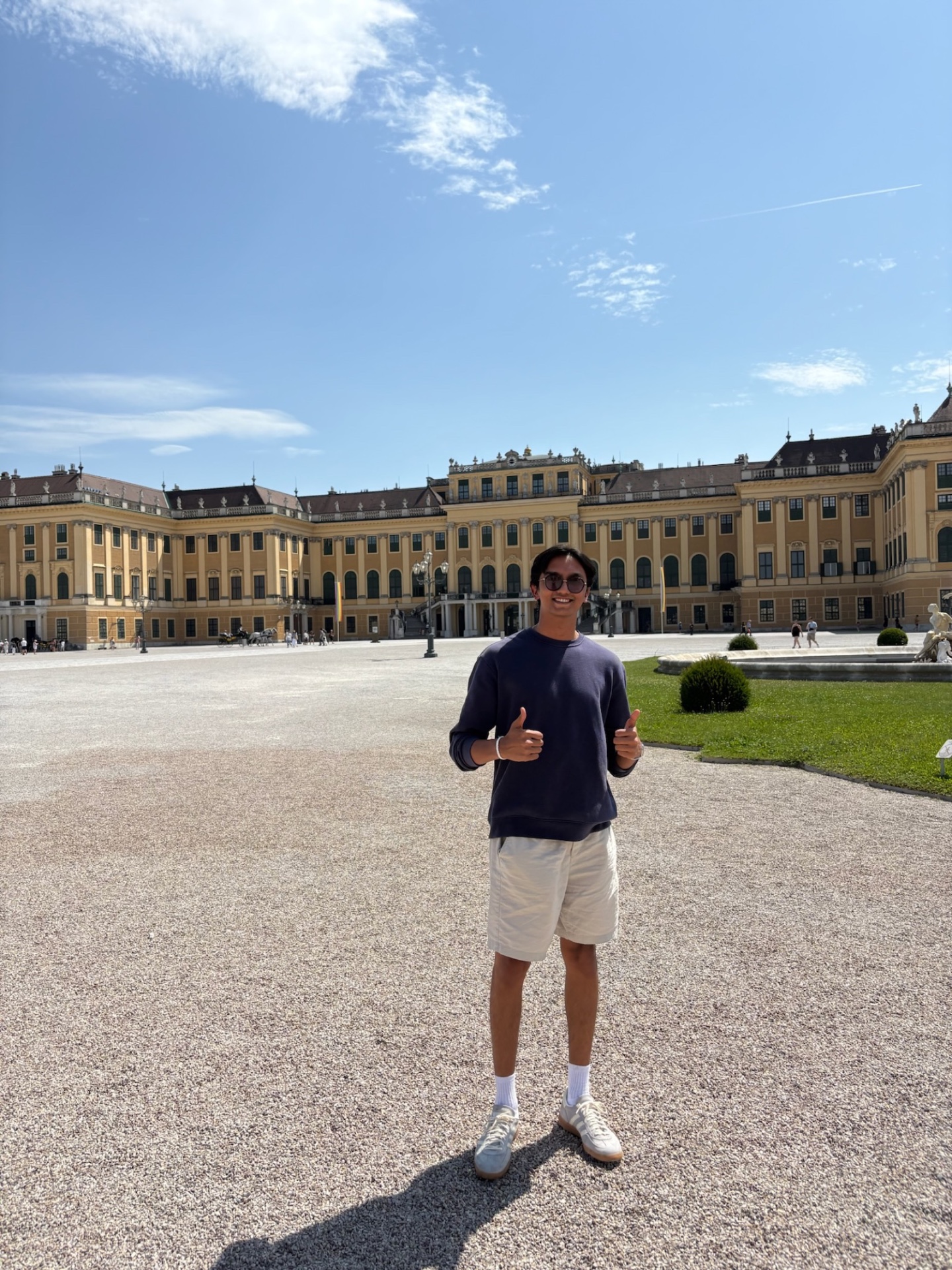 Devam with two thumbs up at Schönbrunn Palace